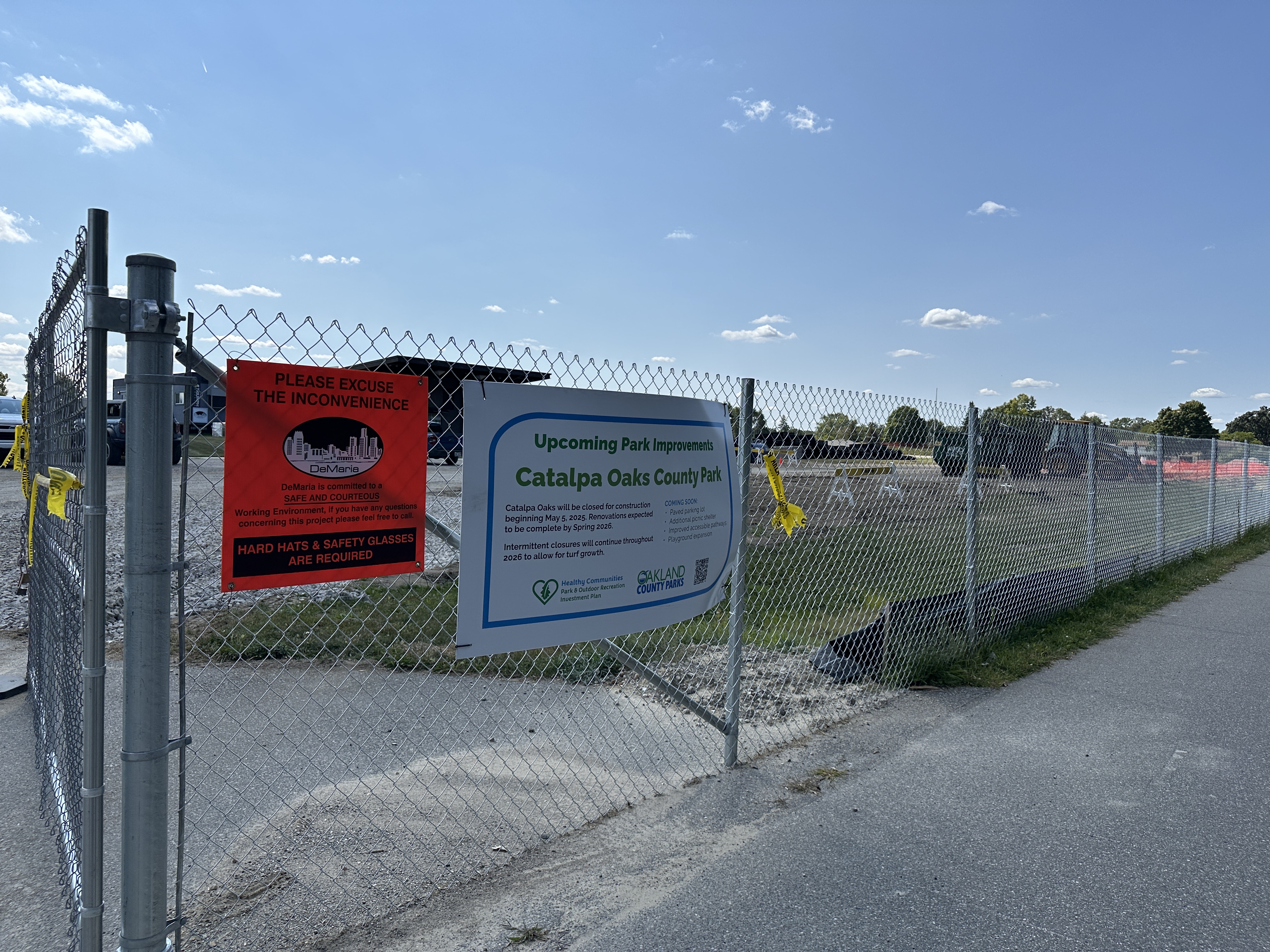 chain-link fencing with a sign describing upcoming park improvements