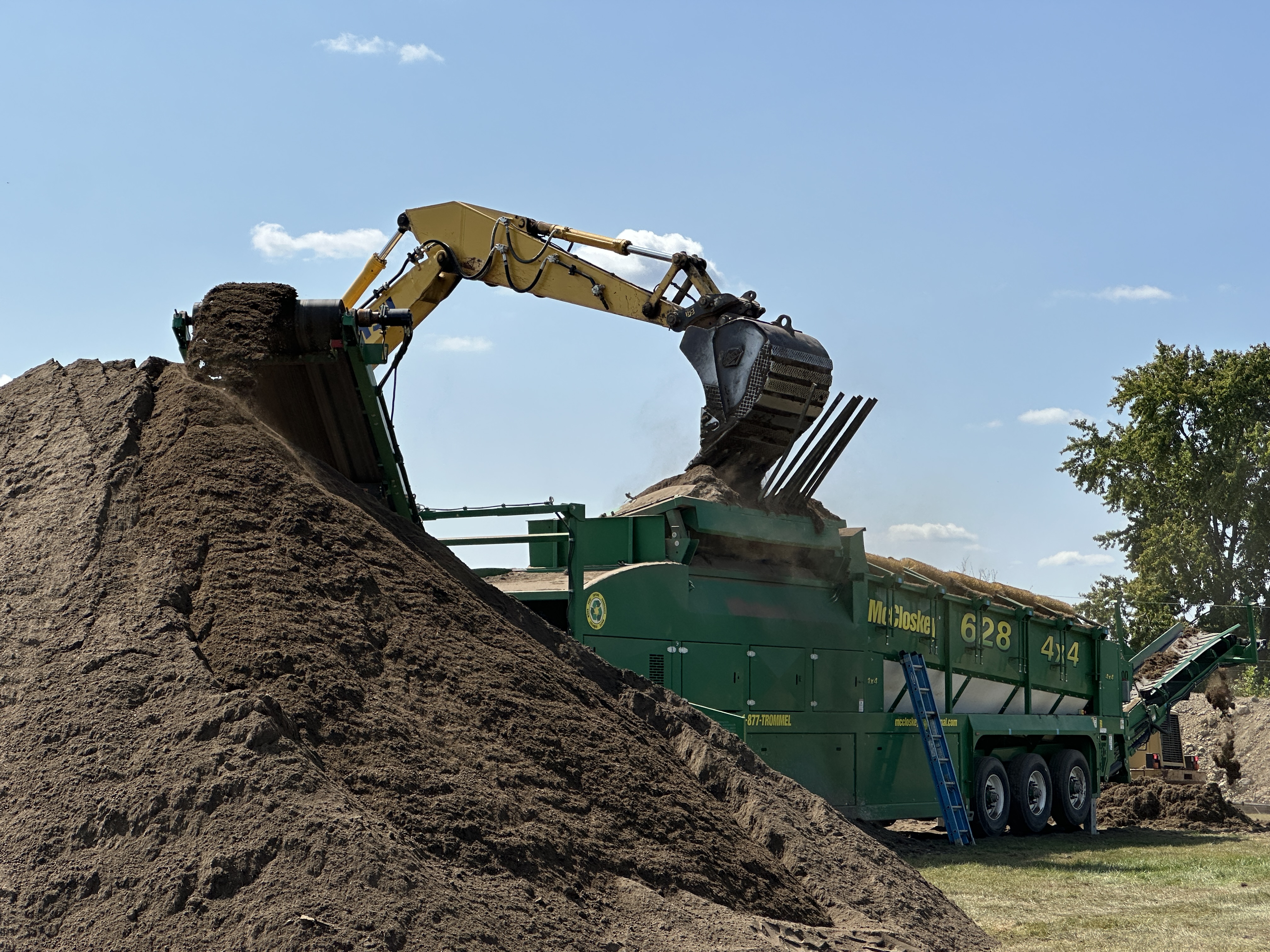 construction equipment moving piles of dirt